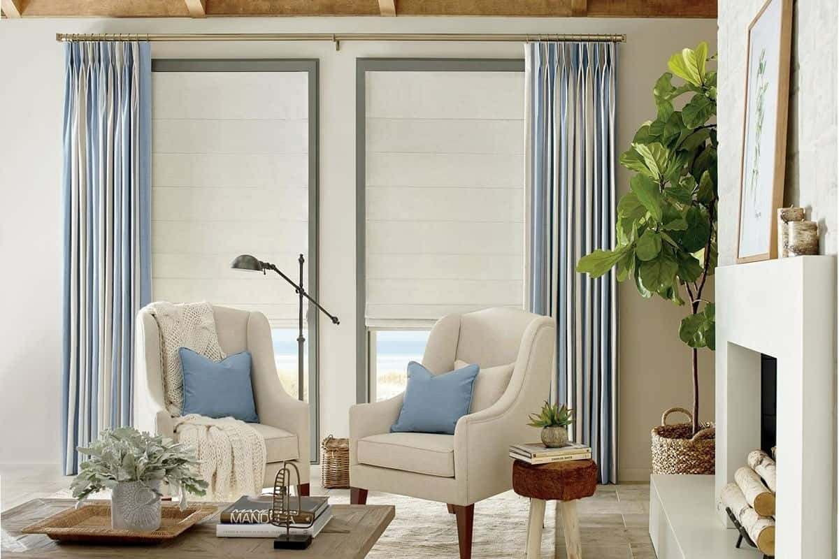 Hunter Douglas Design Studio™ Roman Shades used to absorb sound in a family living room