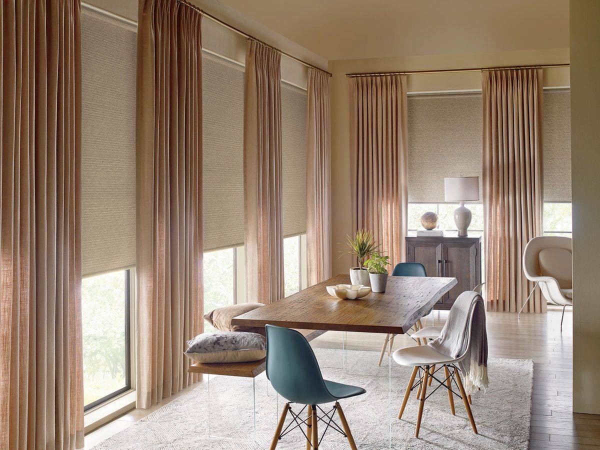 Dining room outfitted with Hunter Douglas Designer Roller Shades near Miami, FL