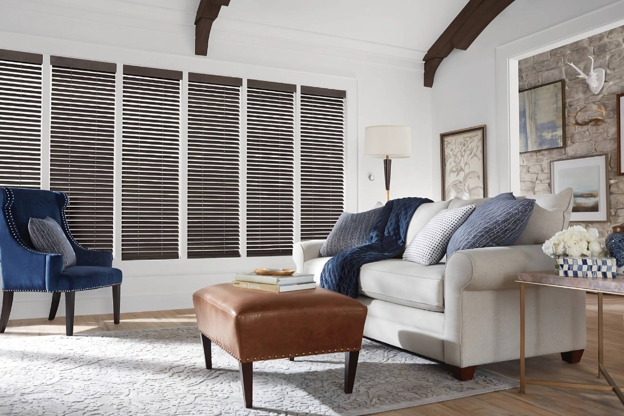 Hunter Douglas Parkland® Wood Blinds as window darkening blinds in a chic living room at Fine Shadings & Décor near Miami, FL