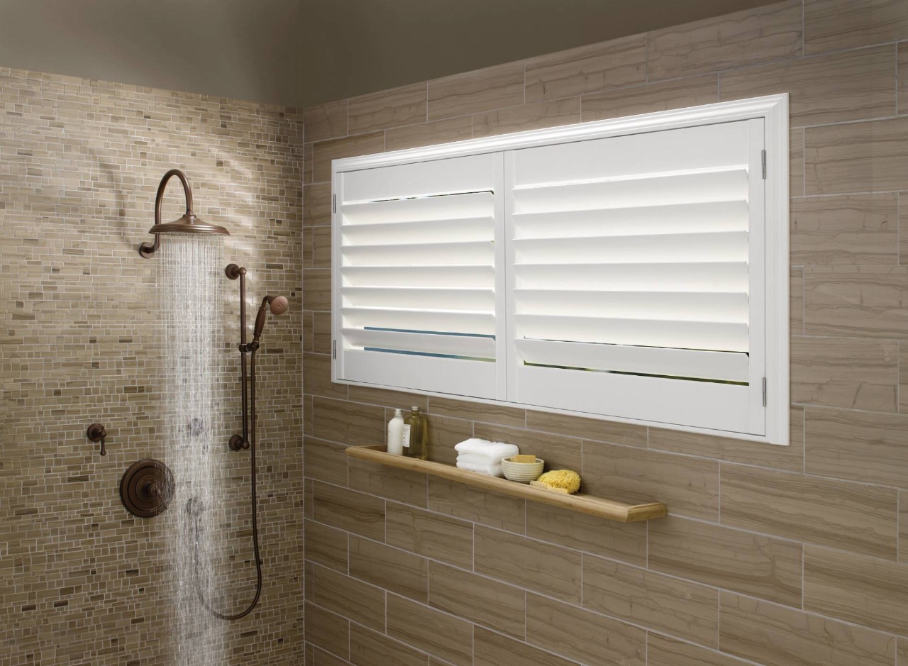 Modern shower with closed white shutters on a horizontal window at Fine Shadings & Décor near Miami, FL
