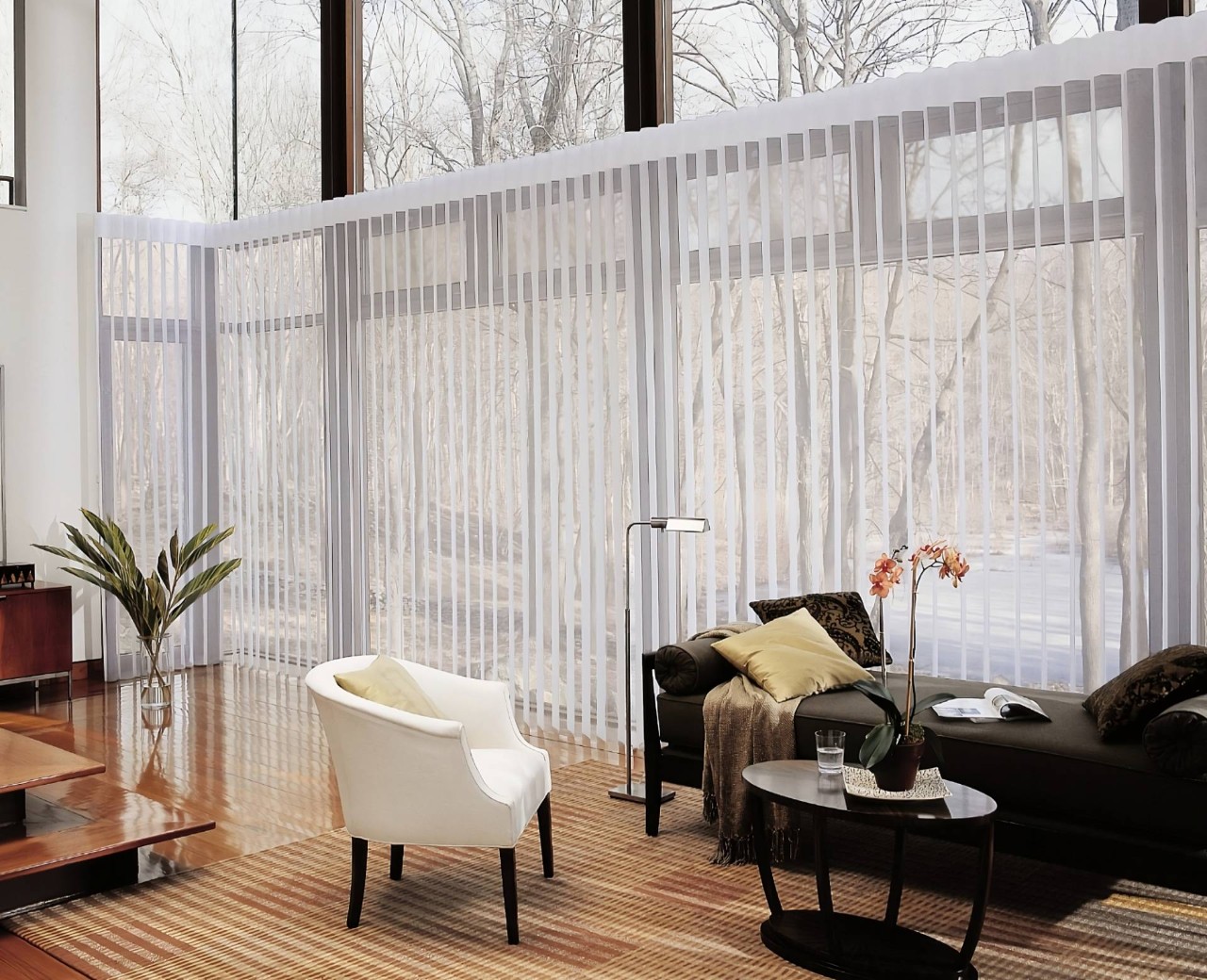 Hunter Douglas Luminette® Sheer Panels as sheer shades on large windows in a modern living room at Fine Shadings & Décor near Miami,(FL)